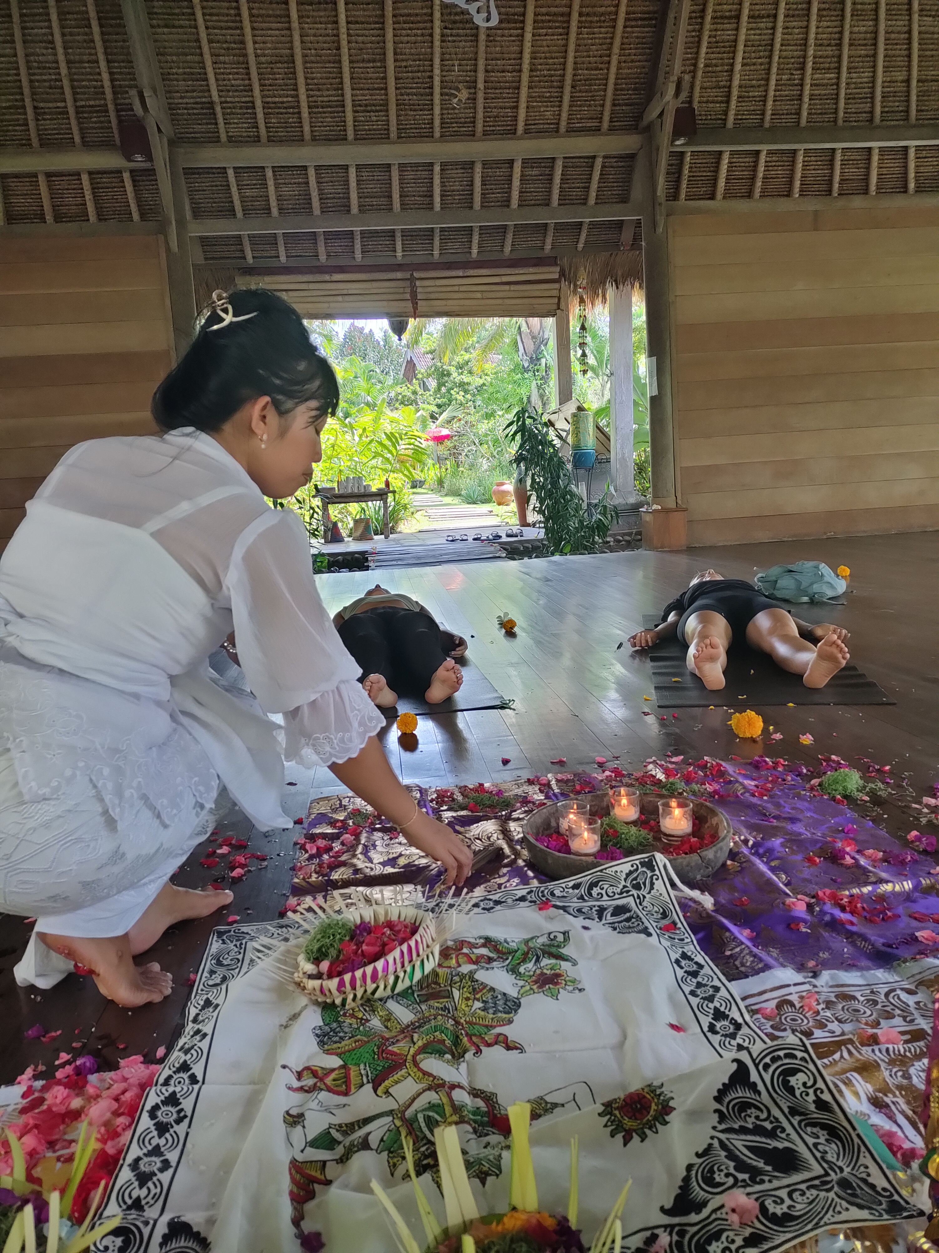 Jero Tya performing a blessing cleansing ceremony in Berawa, Bali.